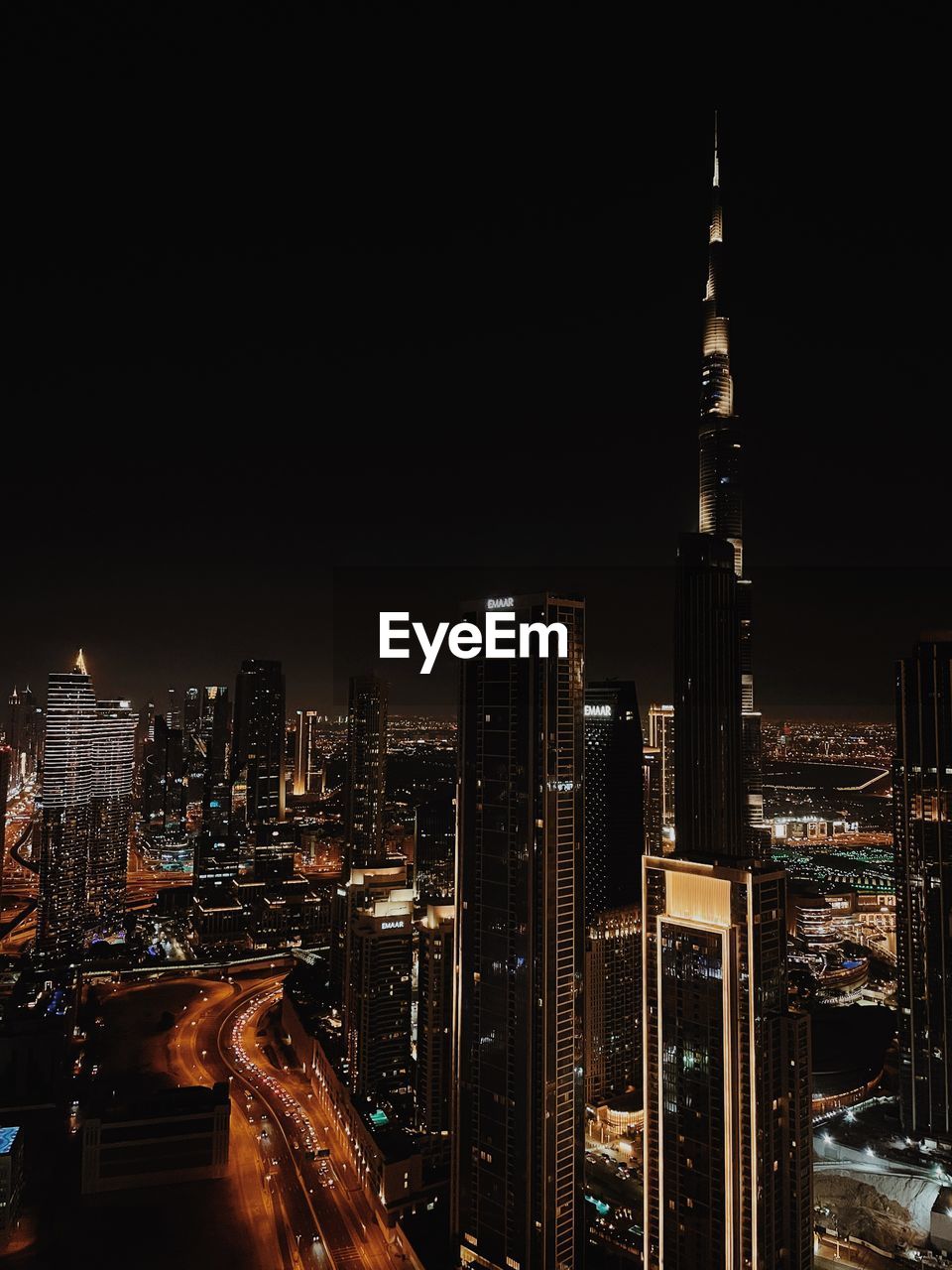 high angle view of illuminated buildings in city at night