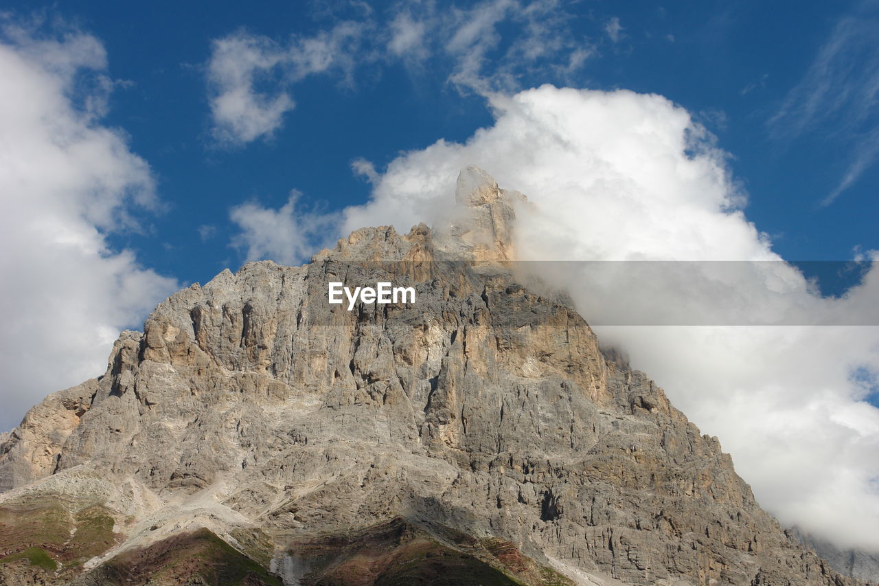 Low angle view of rock formations against sky