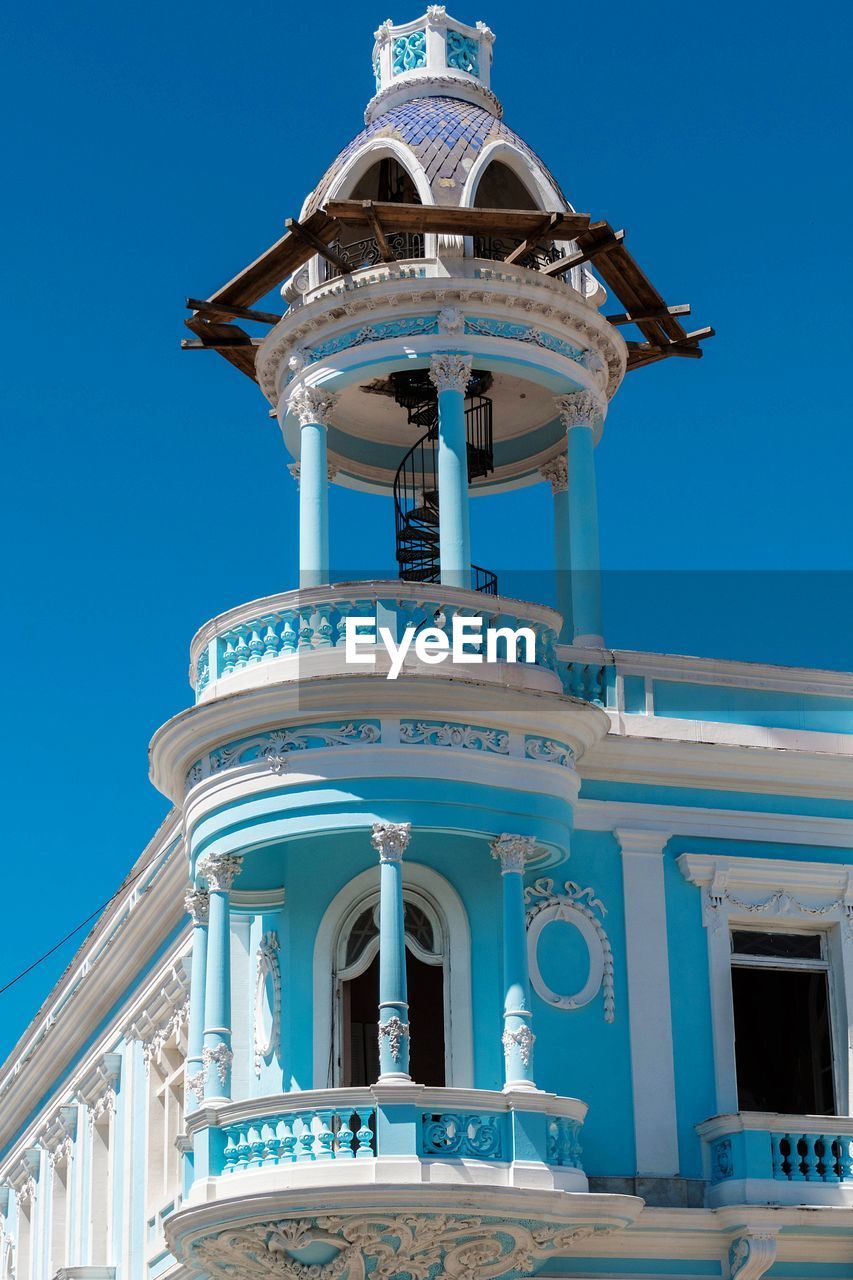 Low angle view of building against blue sky