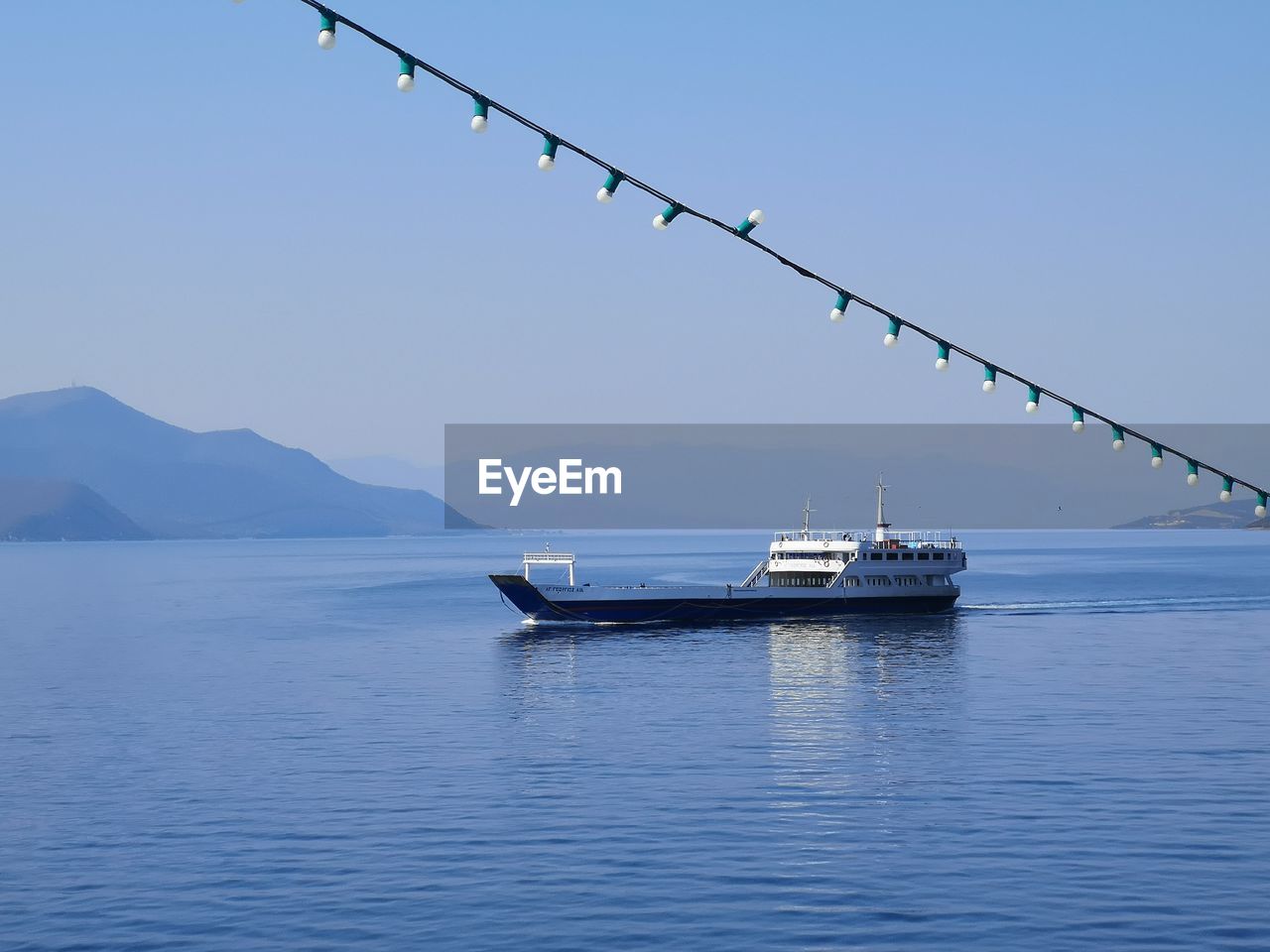 SHIP IN SEA AGAINST CLEAR SKY