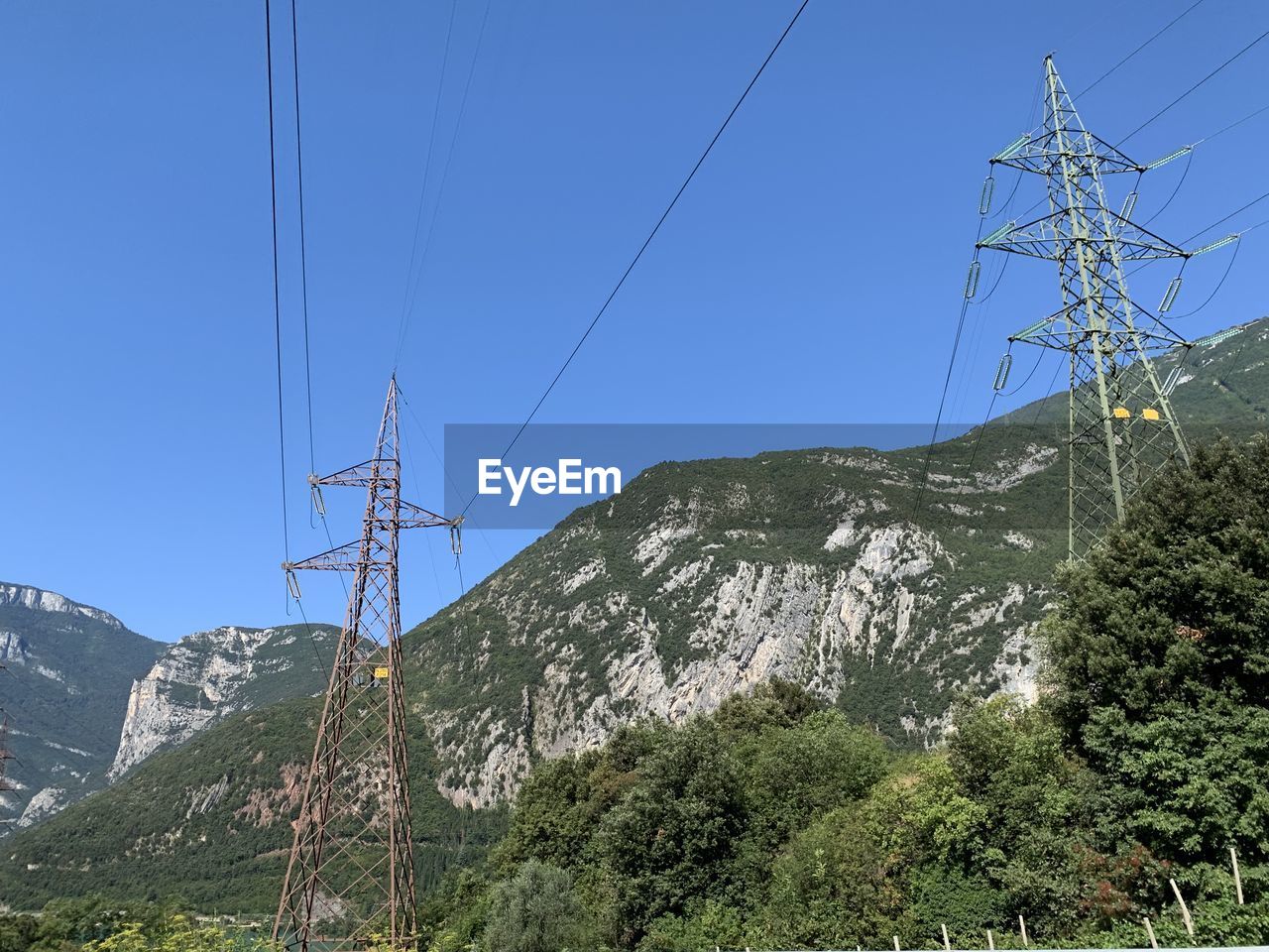 Low angle view of power lines against sky