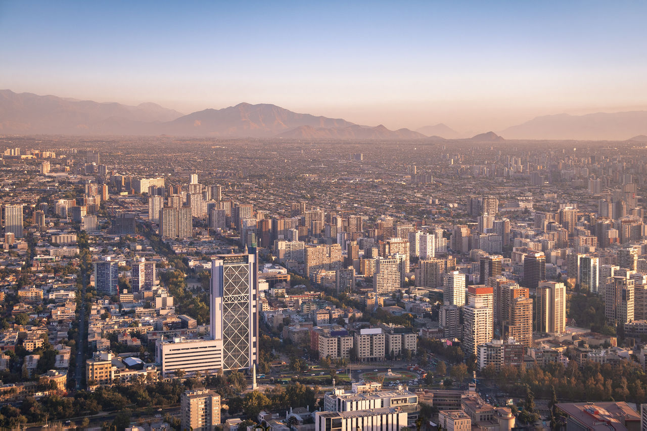 high angle view of cityscape against clear sky during sunset