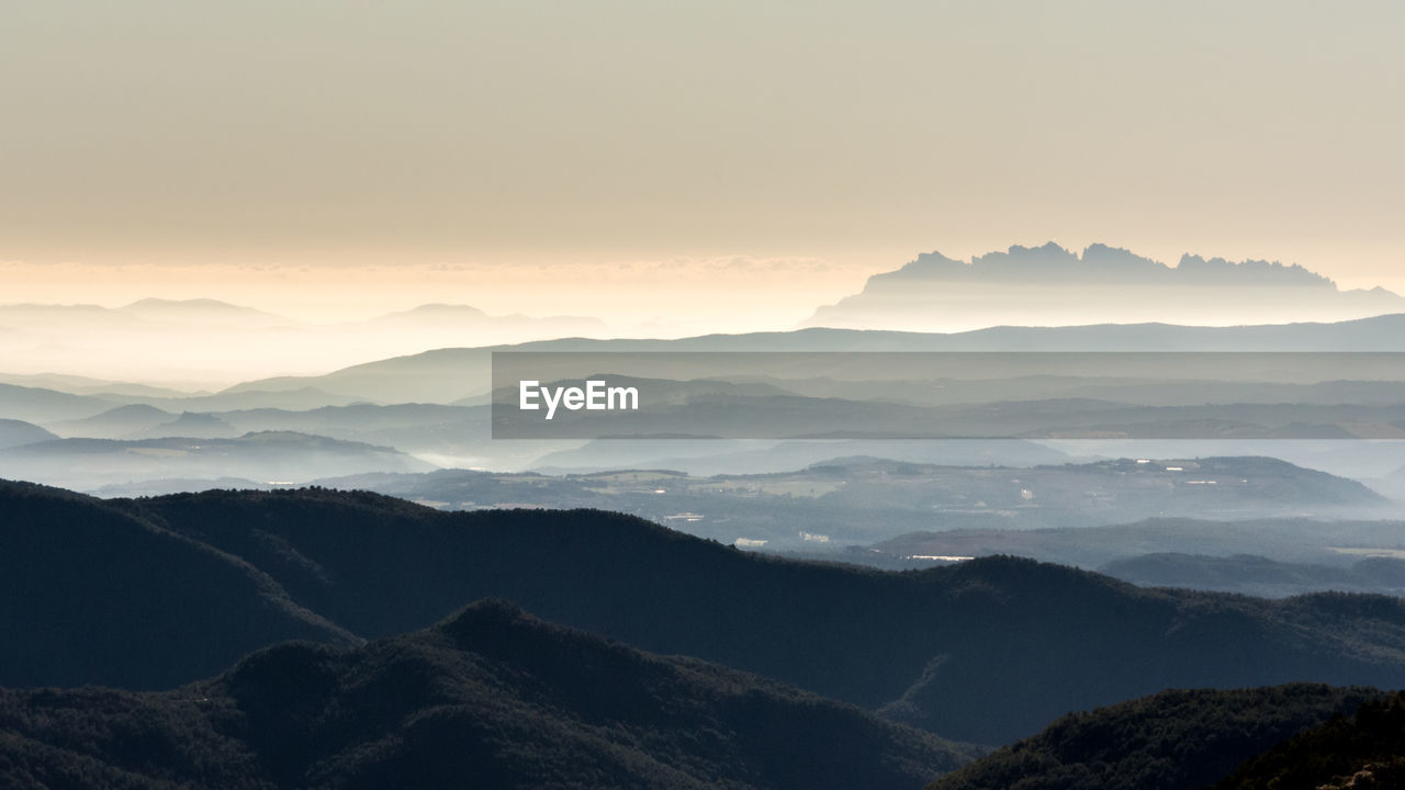 Scenic view of mountains against sky during sunset