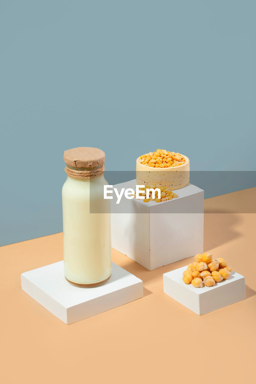 Vegetable pea milk.white podium.gluten and lactose free vegan product.isometric diagonal projection