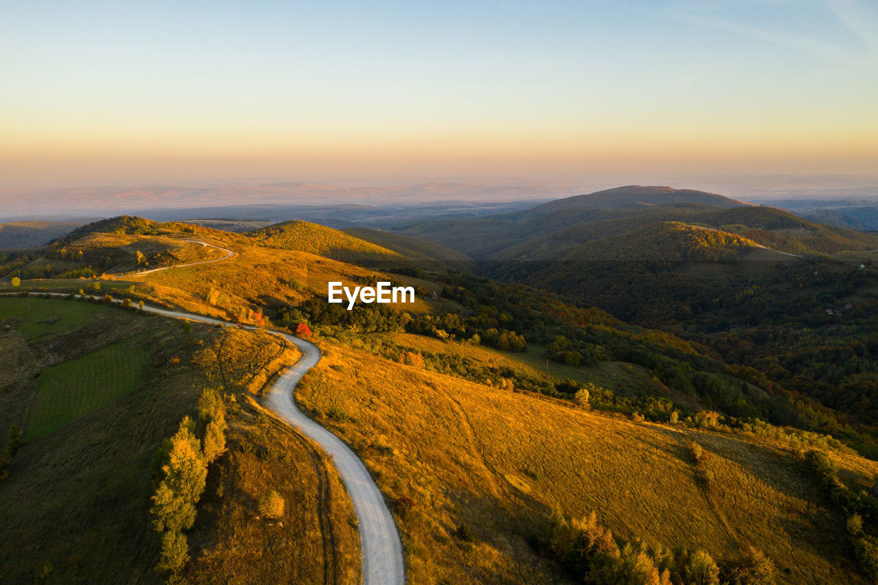 Scenic view of landscape against sky during sunset