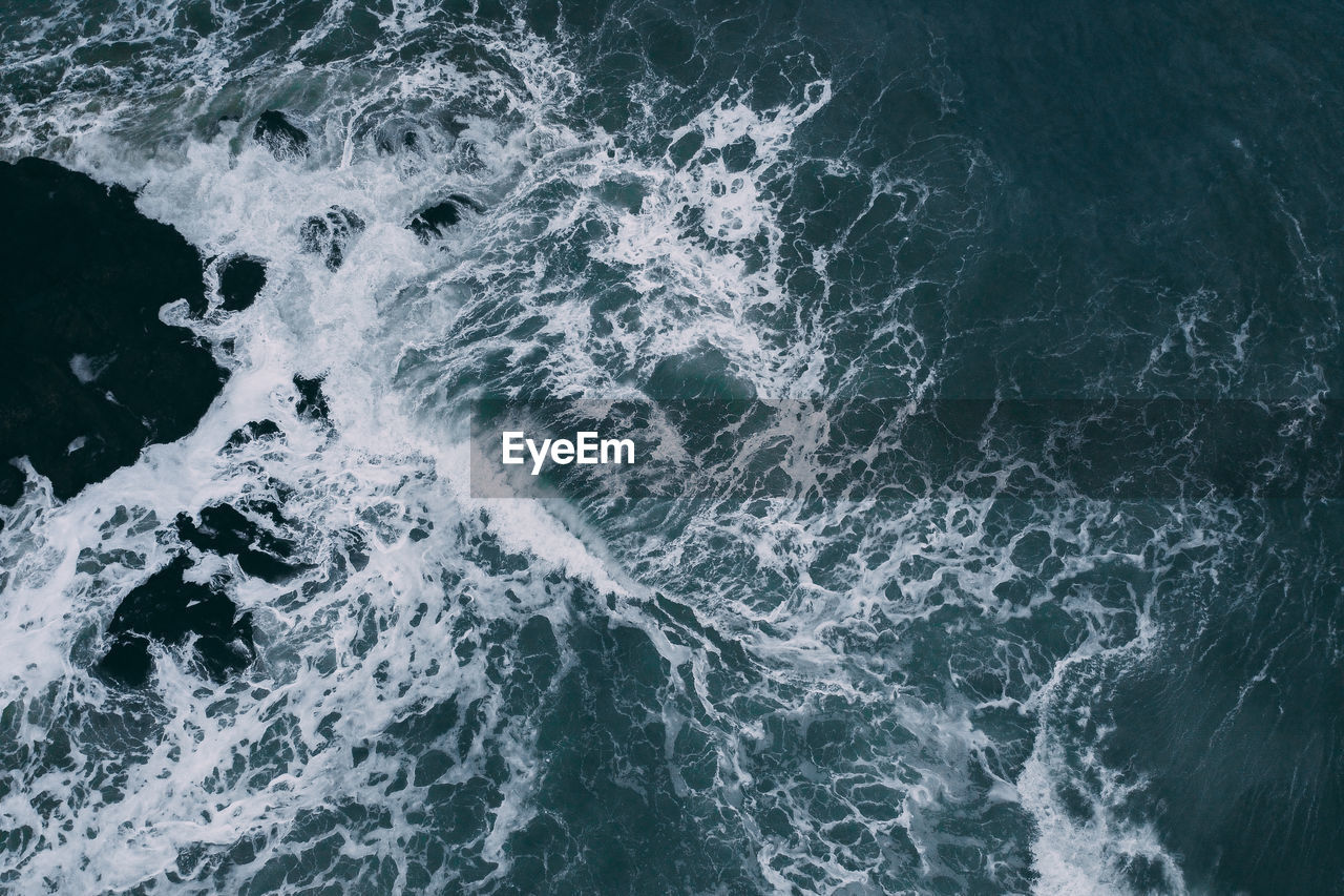 High angle view of water splashing in sea