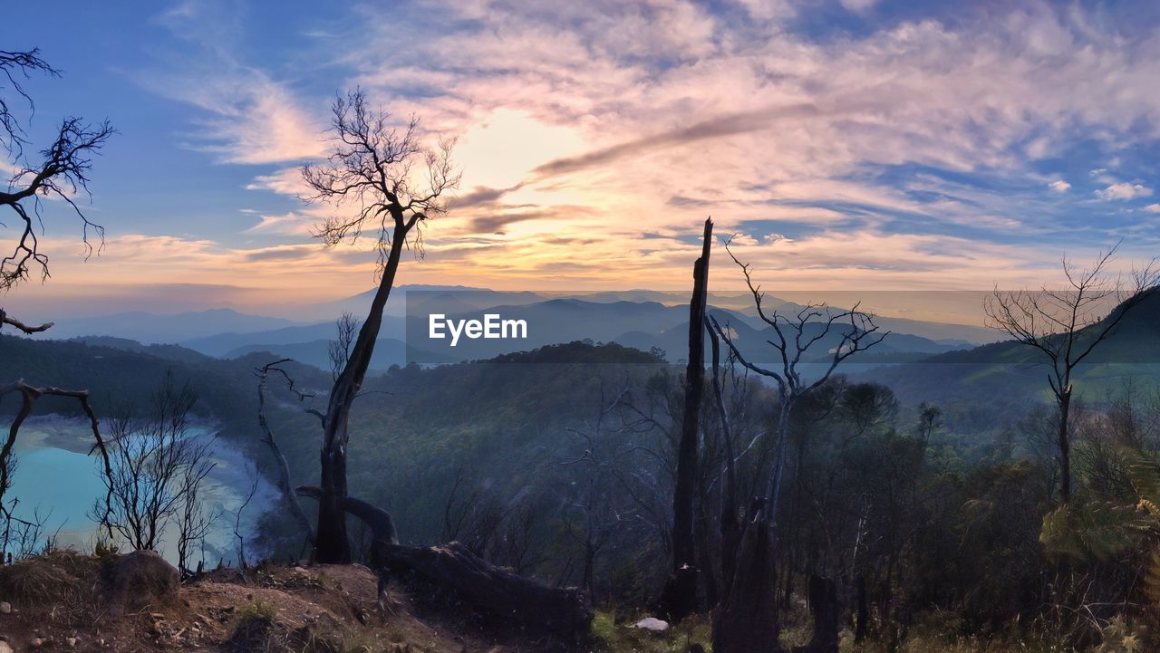 SCENIC VIEW OF LAND AGAINST SKY DURING SUNSET