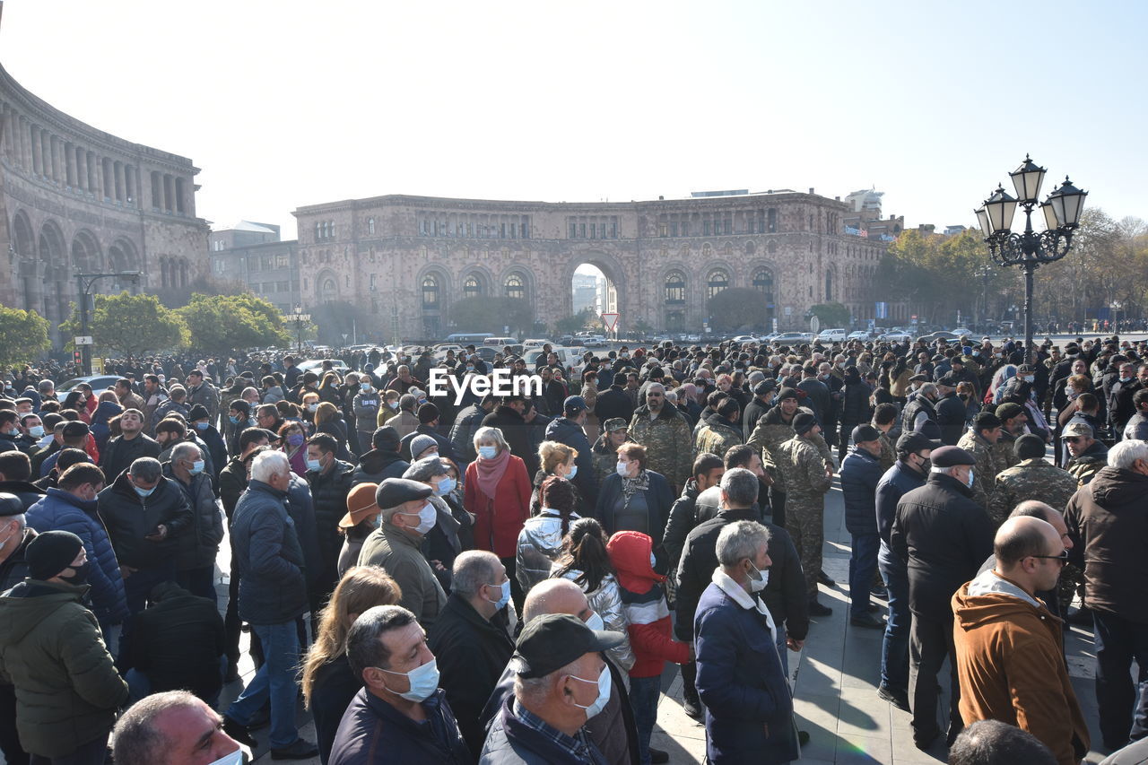 GROUP OF PEOPLE IN CITY