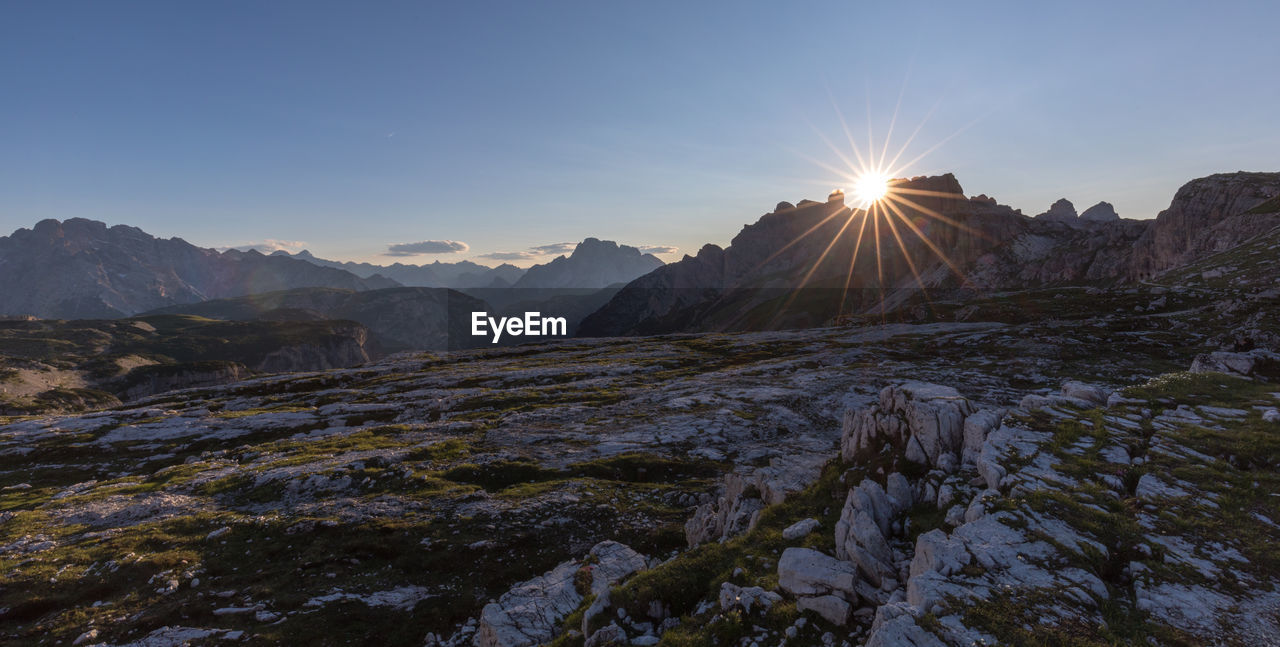 Scenic view of mountains against sky during sunset