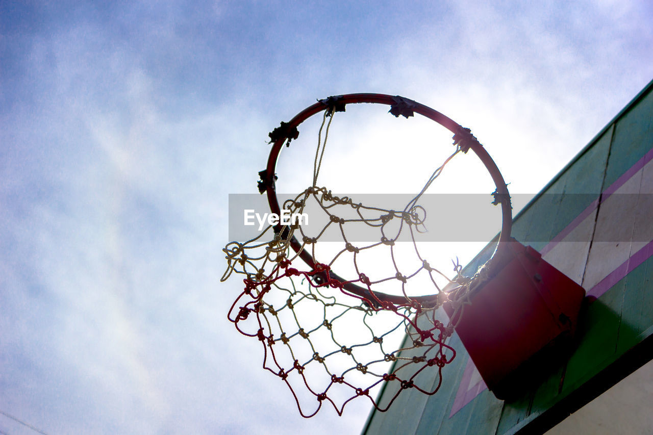 LOW ANGLE VIEW OF BASKETBALL HOOP