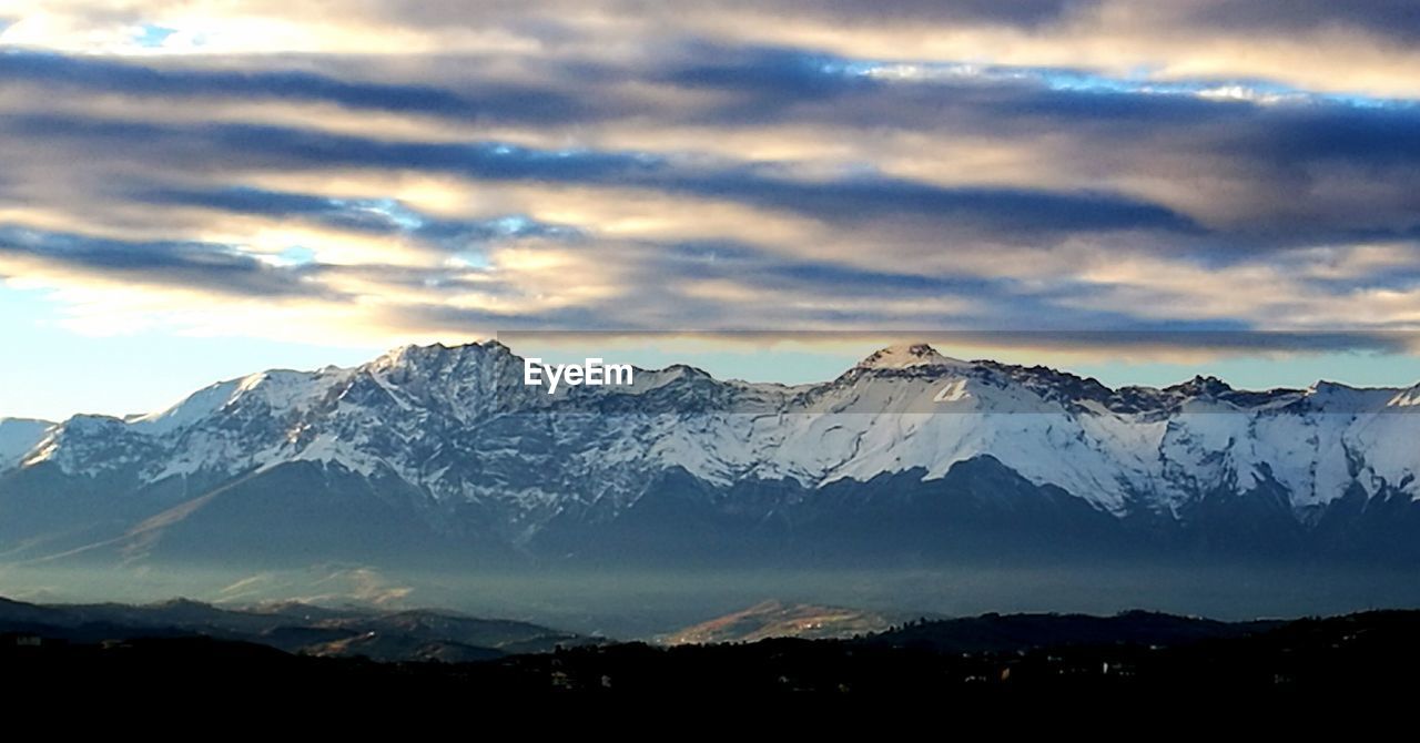 SNOWCAPPED MOUNTAINS AGAINST SKY