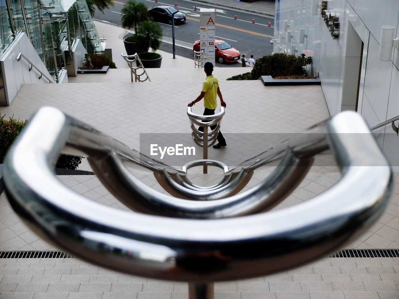 Rear view of man walking down stairs