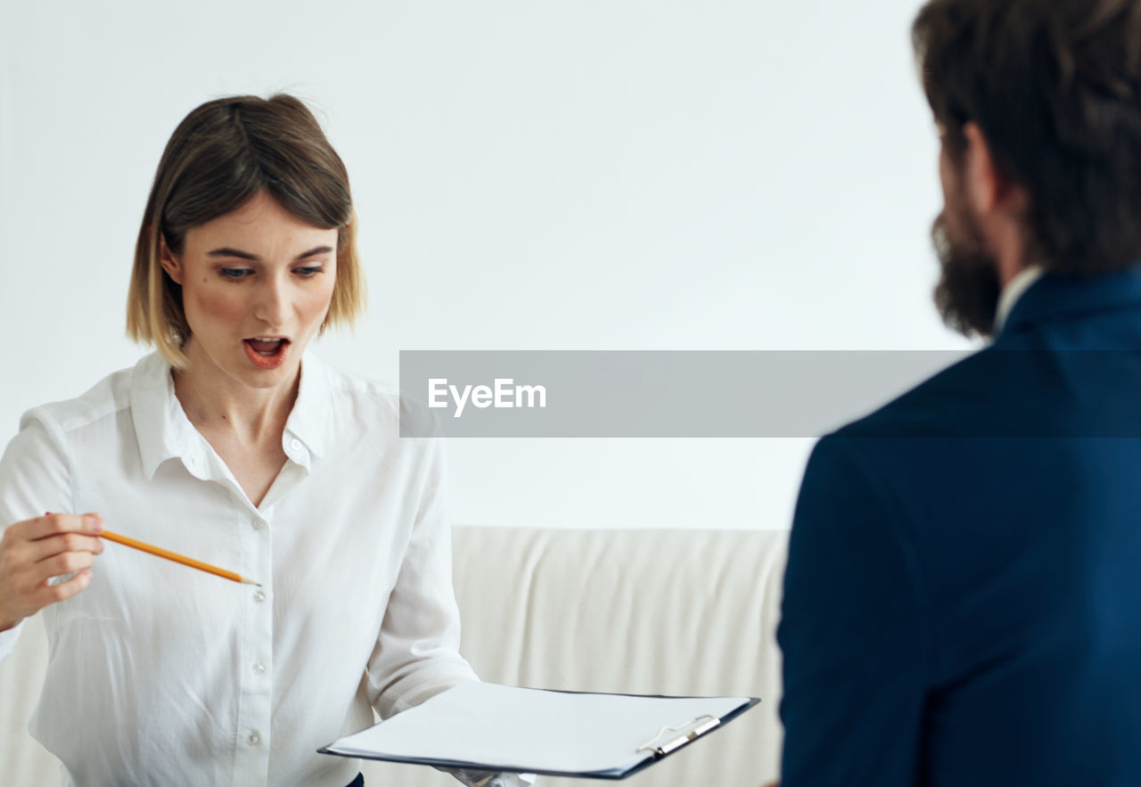 female doctor examining patient in clinic