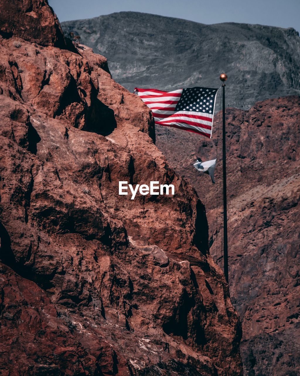 American flag on mountain during sunny day