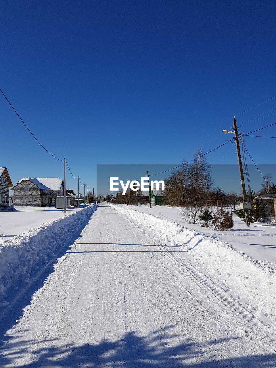 SKI LIFT IN FIELD AGAINST CLEAR BLUE SKY