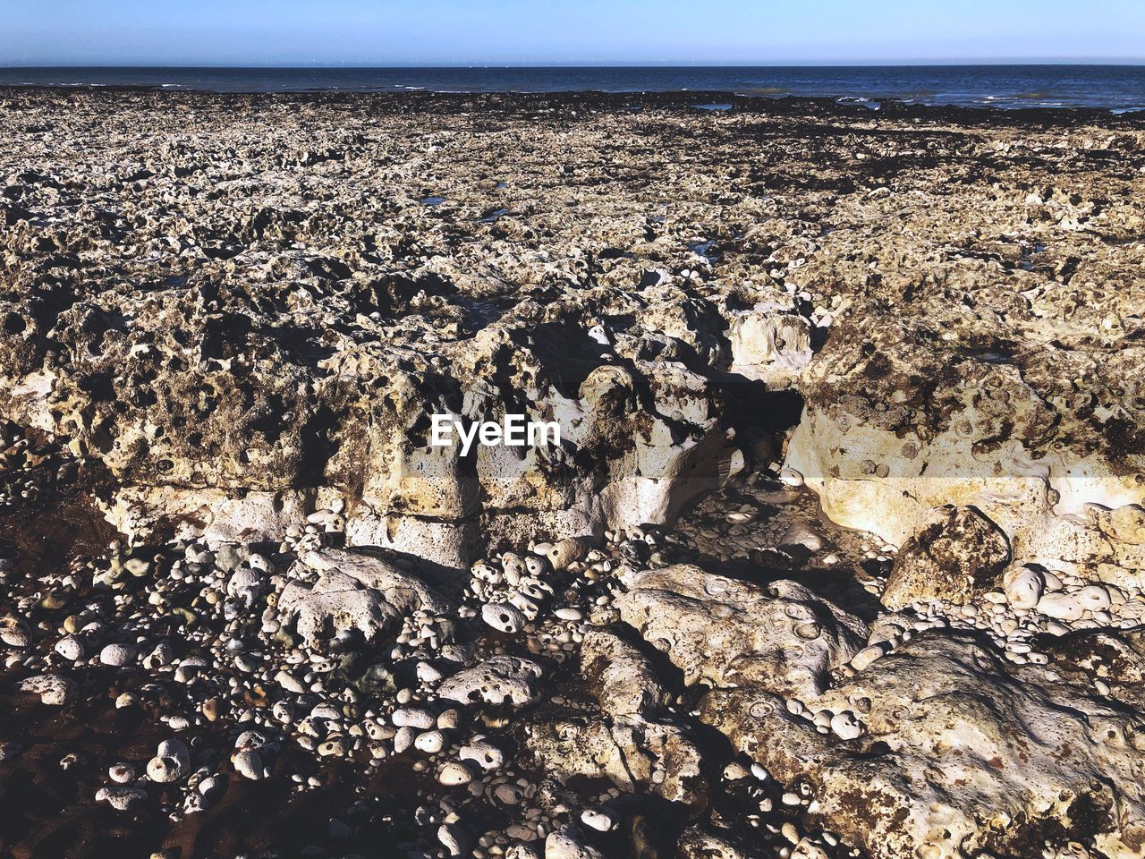 SCENIC VIEW OF ROCKS IN SEA