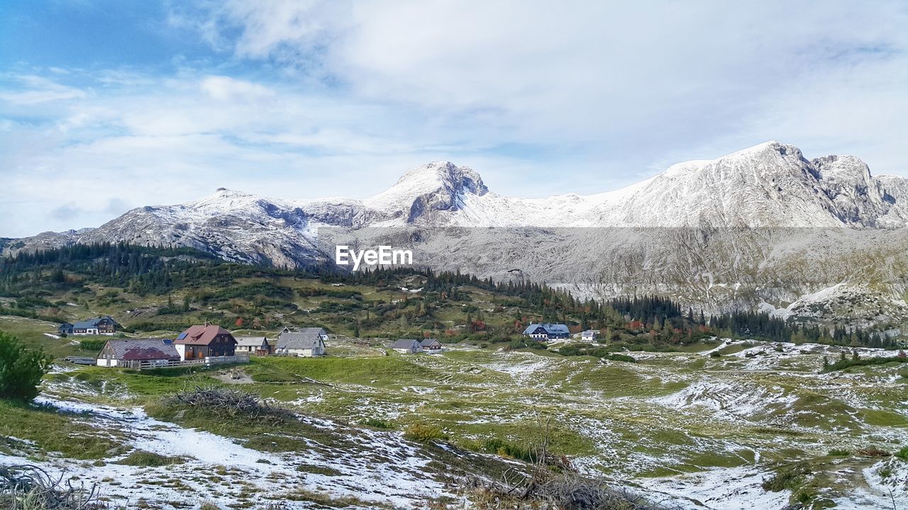 Scenic view of snowcapped mountains against sky