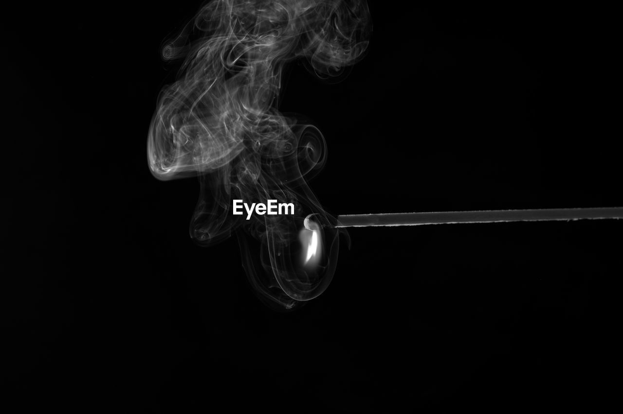 Close-up of smoke against black background