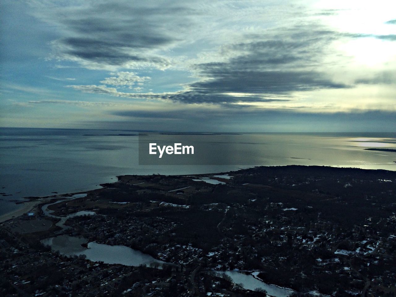 Scenic view of sea against sky at dusk