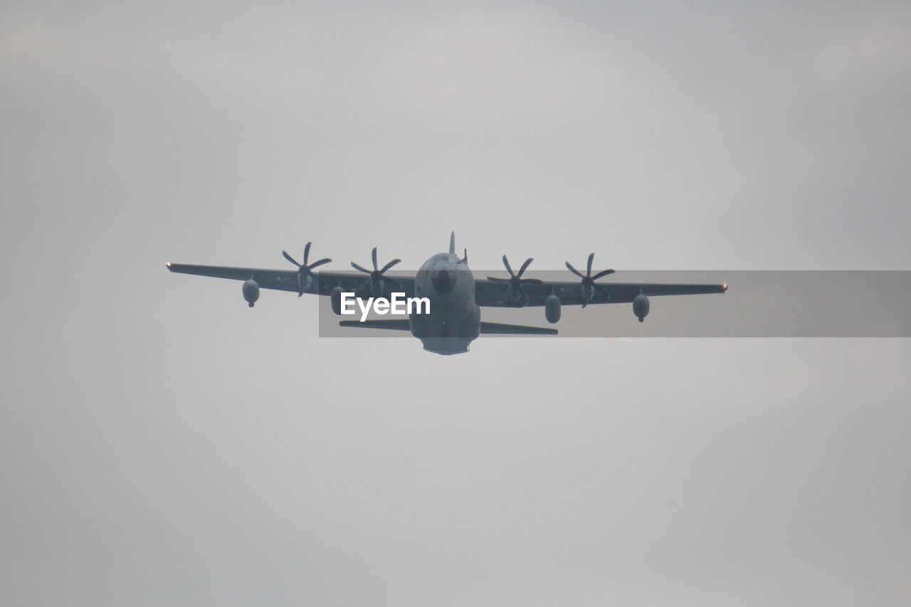 LOW ANGLE VIEW OF AIRPLANE IN SKY