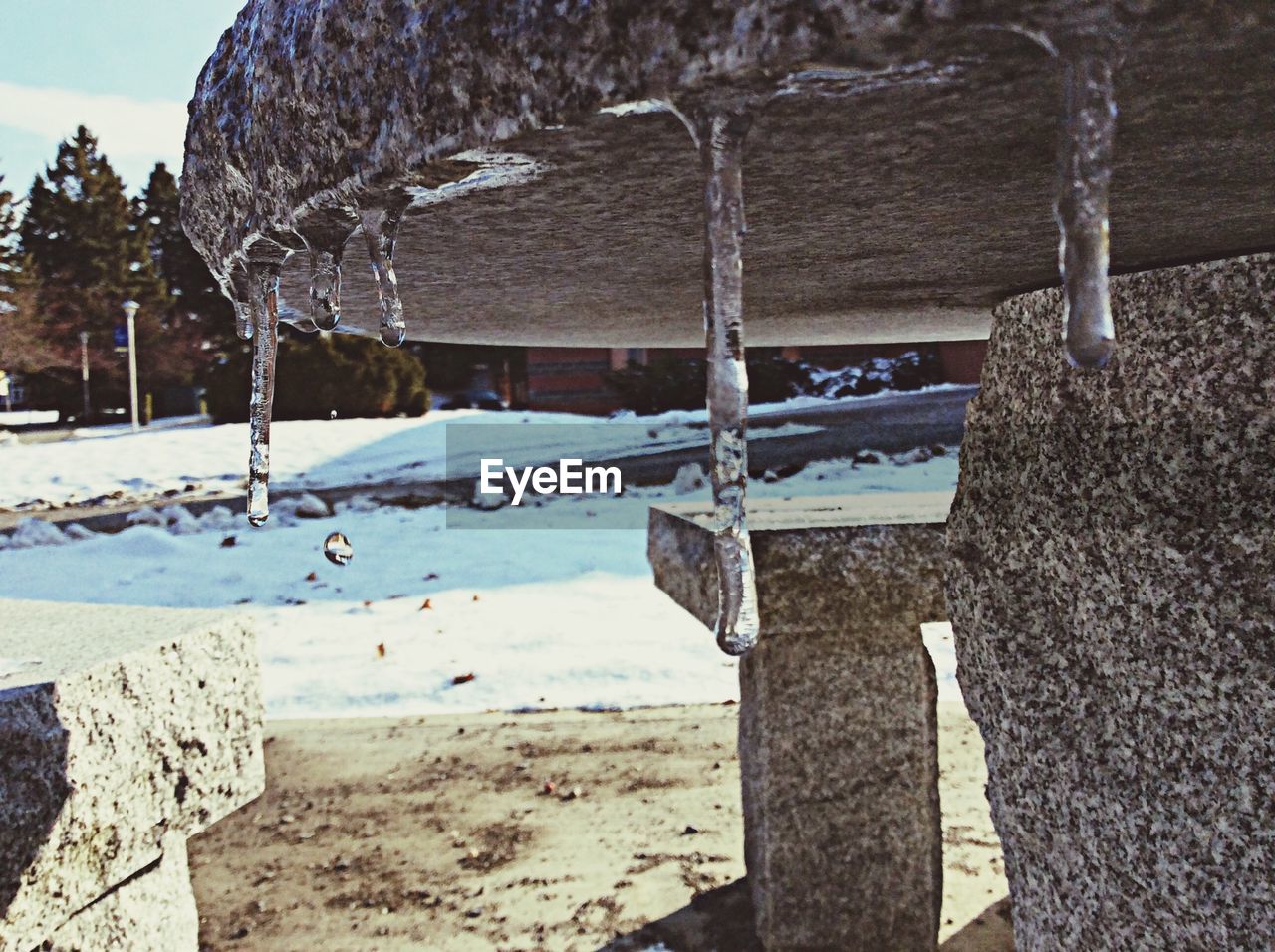 Close-up of icicles on stone table