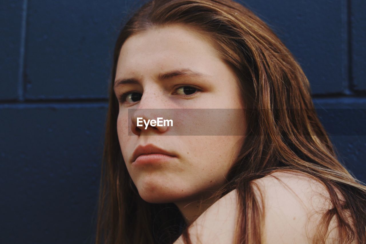 CLOSE-UP PORTRAIT OF BEAUTIFUL YOUNG WOMAN