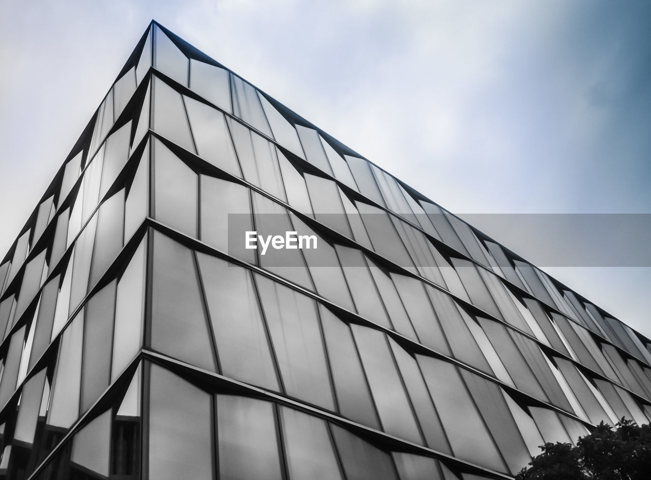 Low angle view of office building against sky