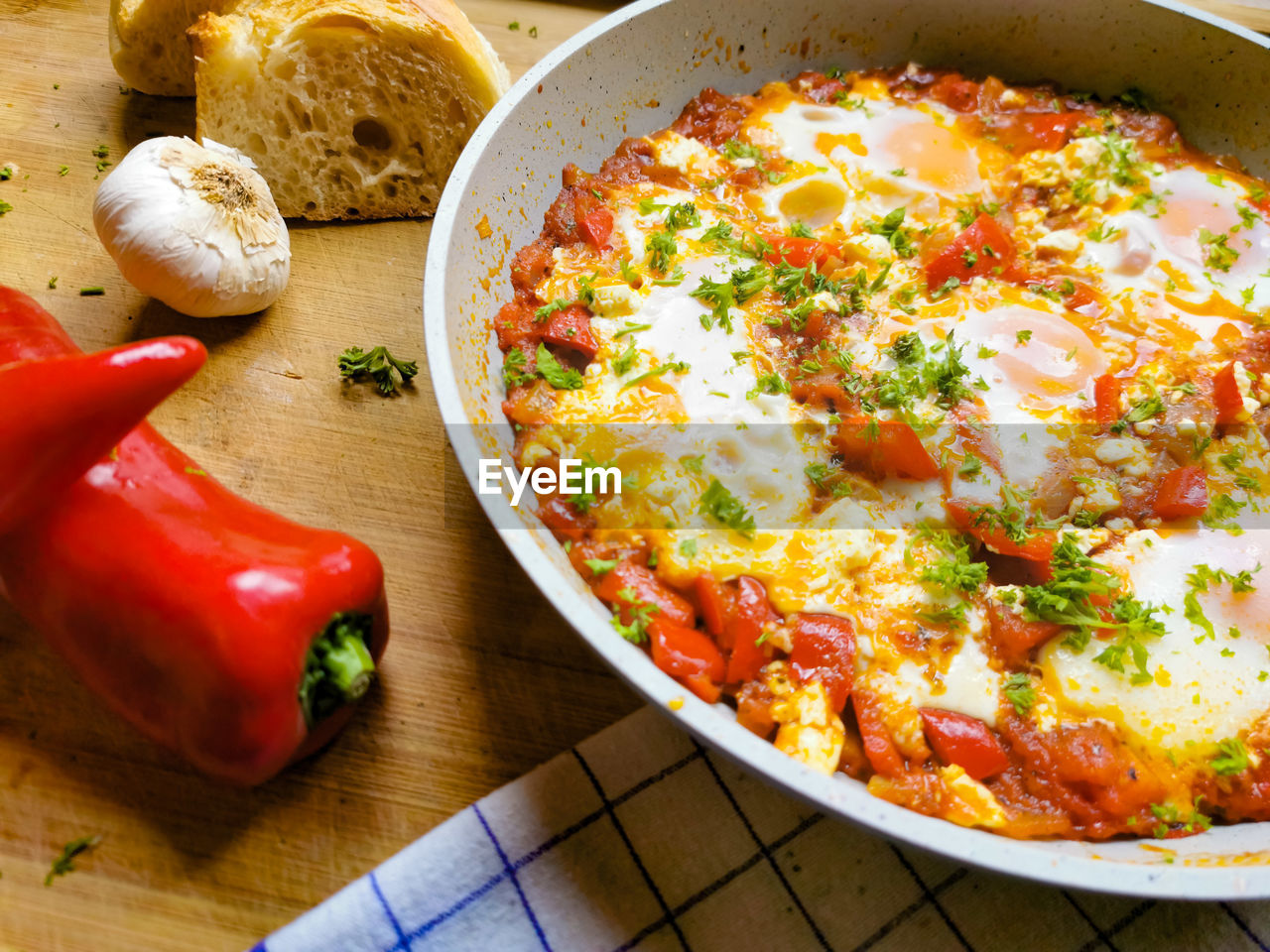 Shakshuka with bread and cheese and eggs