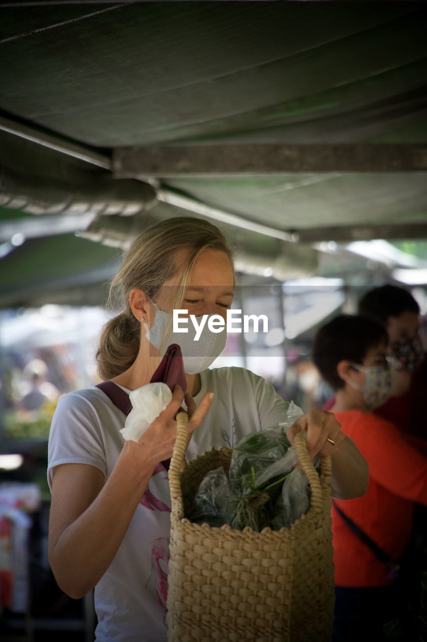 Woman holding food in market