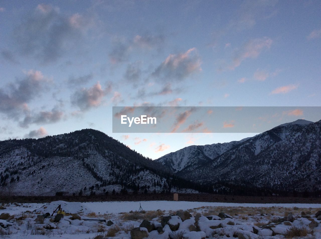 Scenic view of mountains against sky during winter