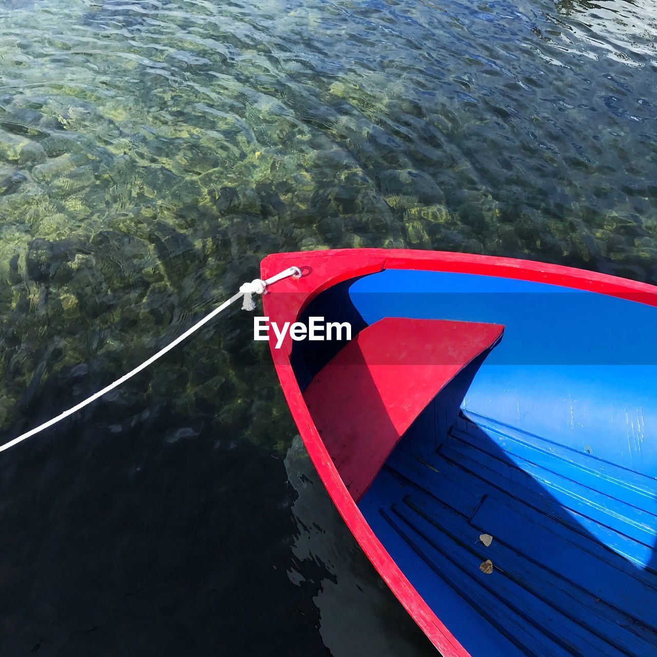 High angle view of red boat moored on river