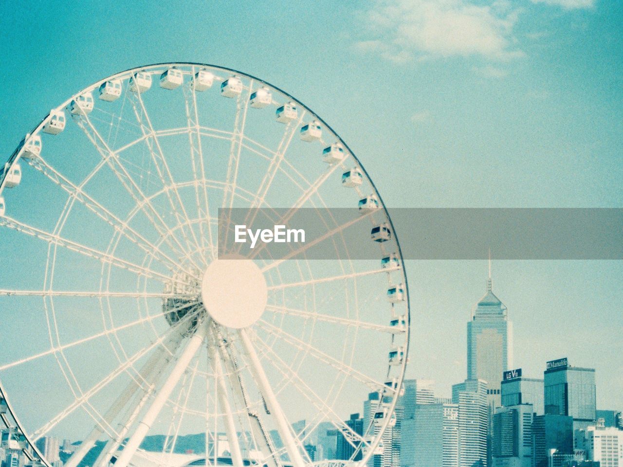 Low angle view of ferris wheel against sky