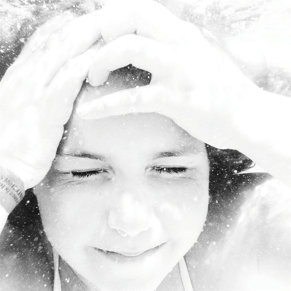 Close-up of girl with eyes closed in underwater