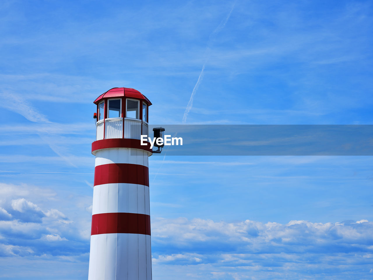 Red-white lighthouse on lake neusiedlersee in austria