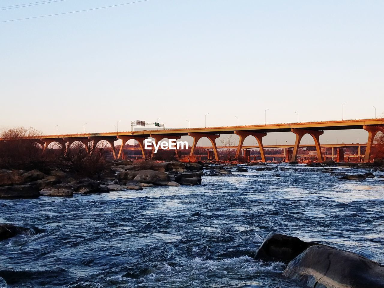 VIEW OF BRIDGE OVER RIVER AGAINST SKY