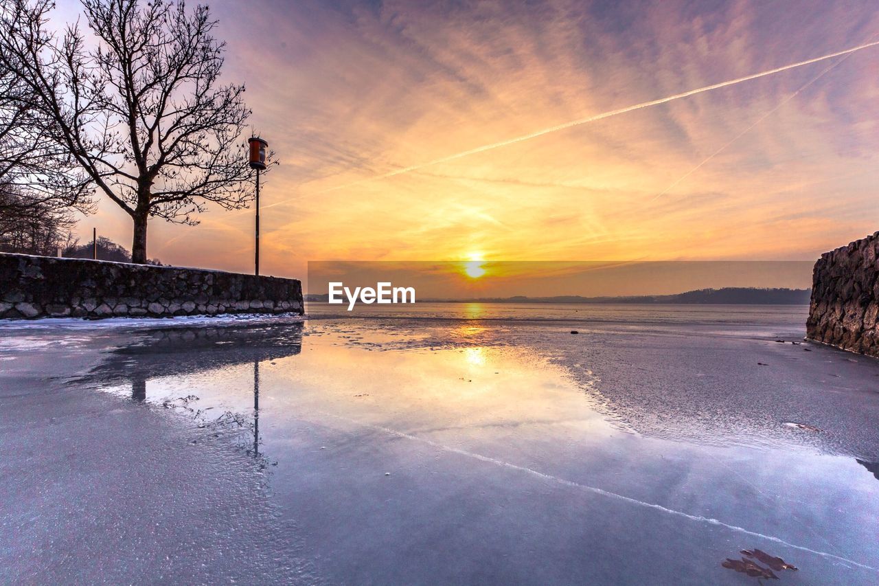 SCENIC VIEW OF SUNSET OVER LAND