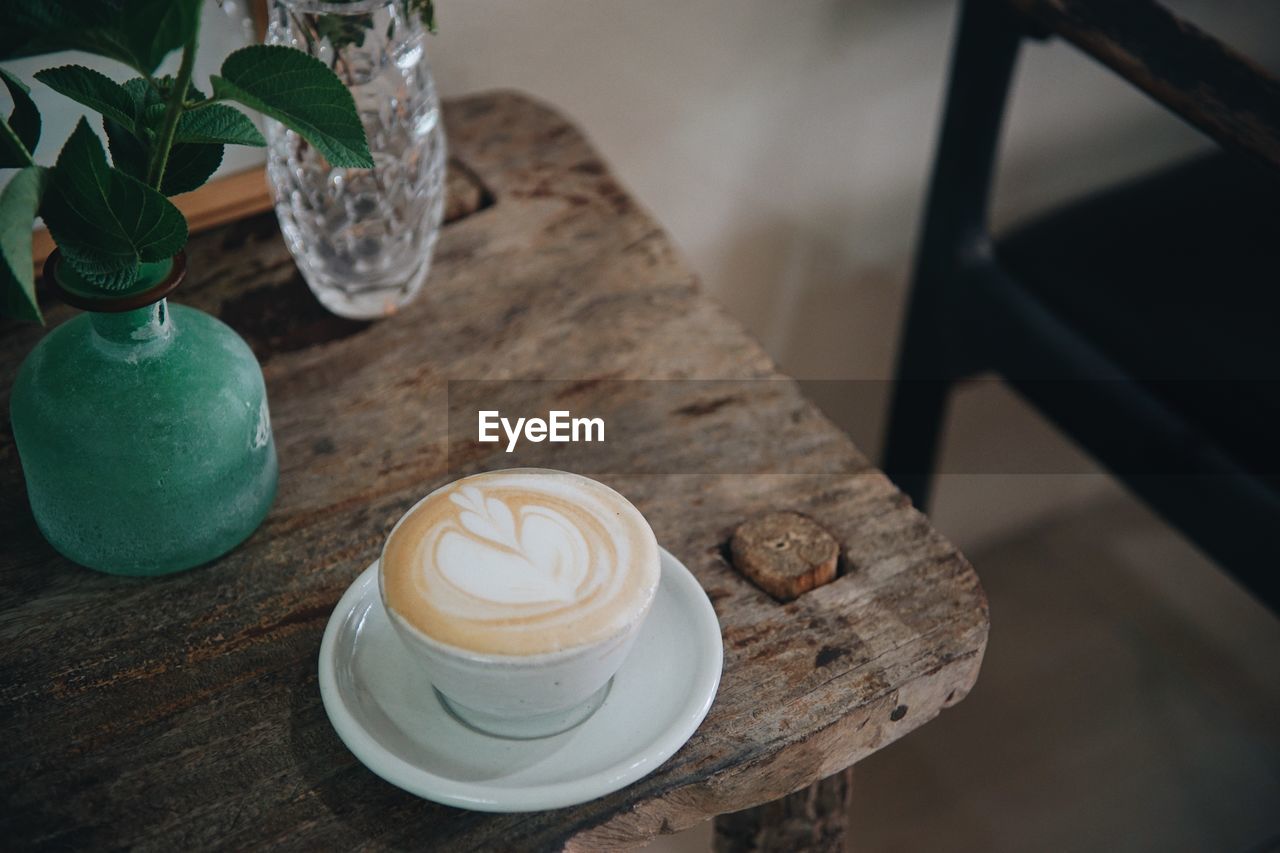 High angle view of coffee cup on table