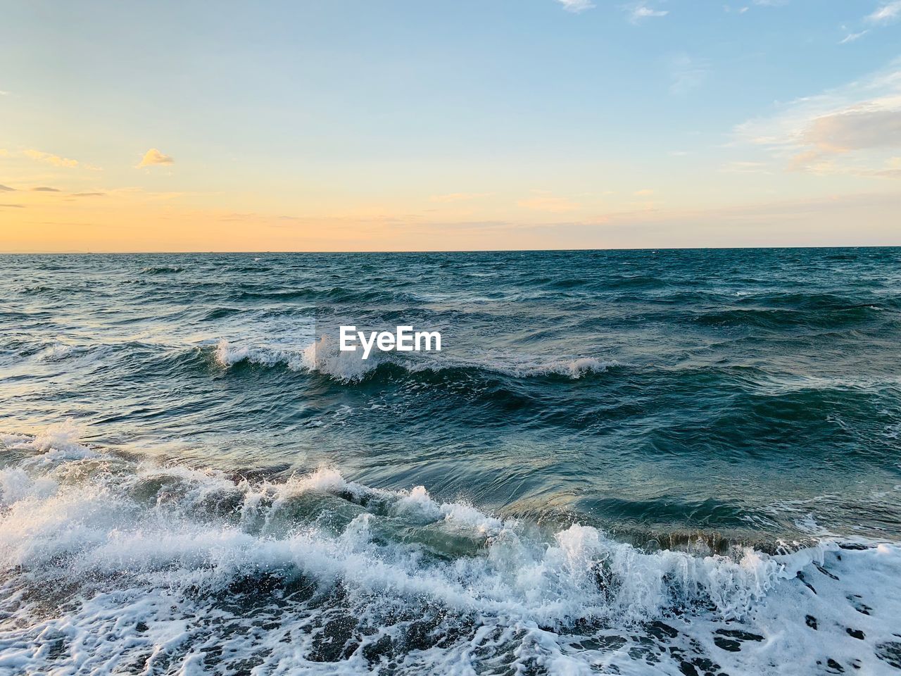Scenic view of sea against sky during sunset