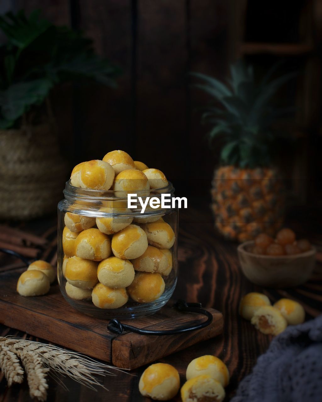 food and drink, food, fruit, healthy eating, pineapple, freshness, plant, wellbeing, produce, yellow, wood, ananas, citrus, no people, citrus fruit, tropical fruit, abundance, rustic, indoors, still life, large group of objects