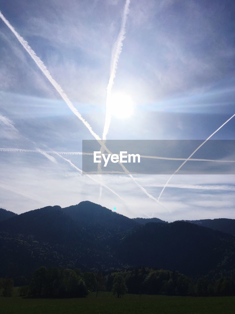 Scenic view of vapor trails against sky