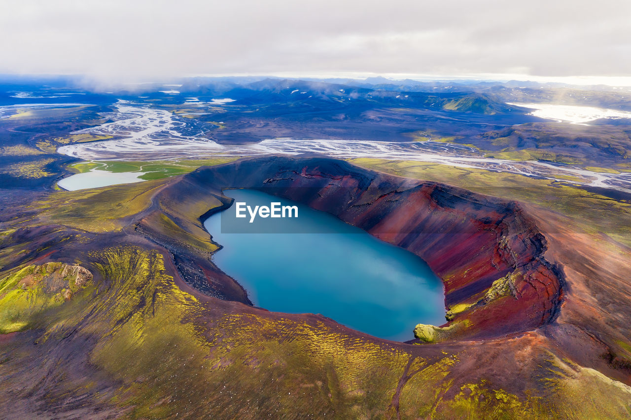 Aerial view of volcanic landscape against sky