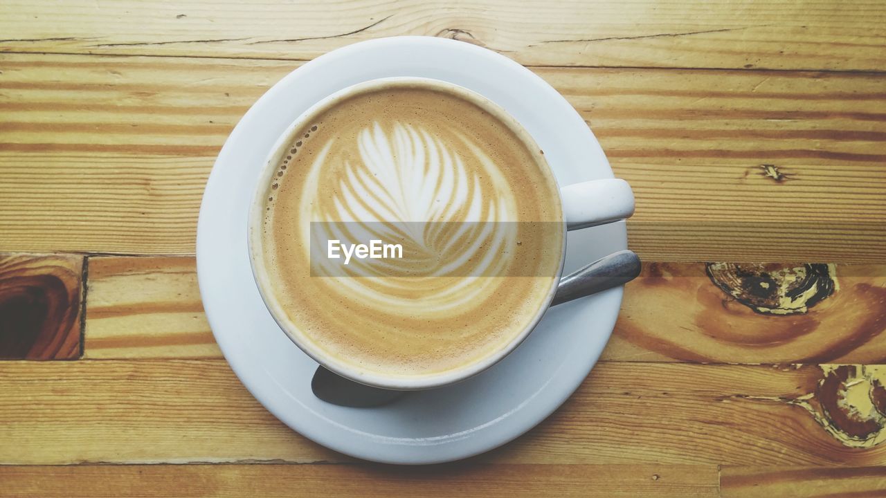 Directly above shot of coffee on wooden table