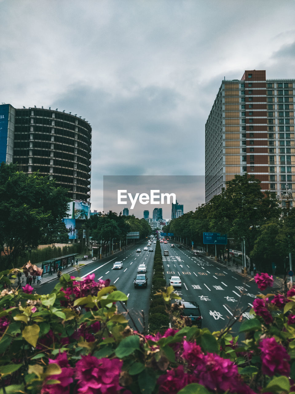 Street amidst buildings in city against sky