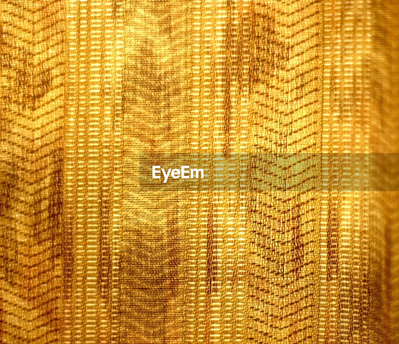 Full frame shot of golden curtain