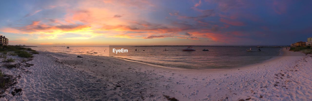 Scenic view of beach against sky during sunset