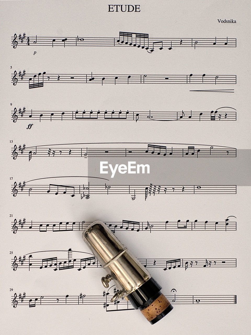 Directly above shot of musical equipment on sheet music