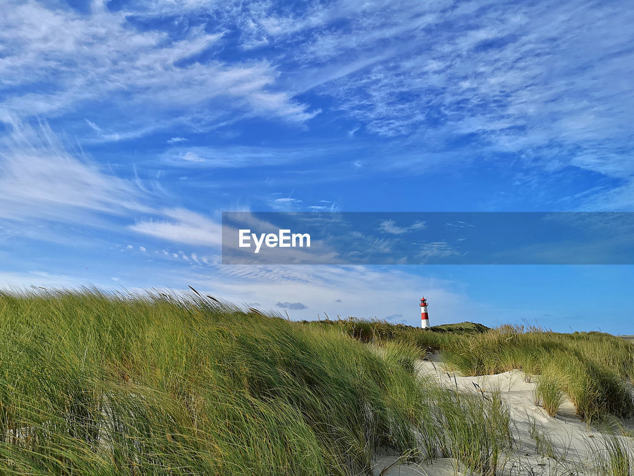 Lighthouse sylt ost in list on island sylt with blue clouded sky