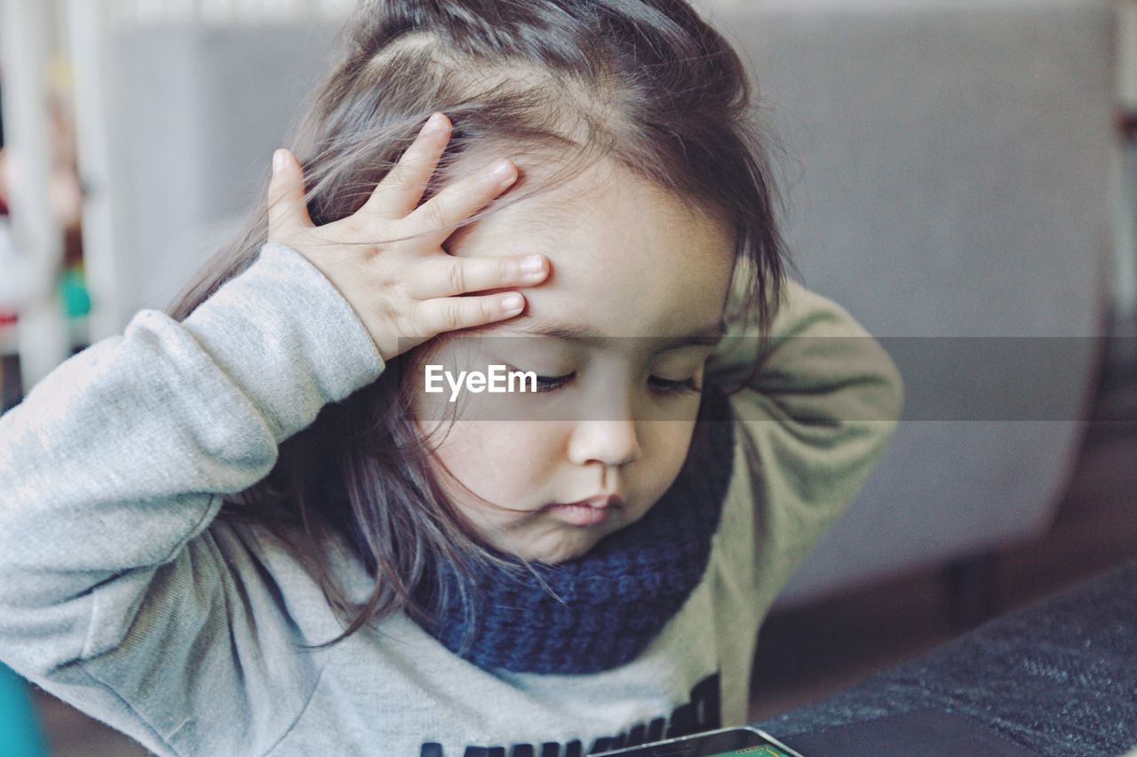 Close-up of cute girl at home