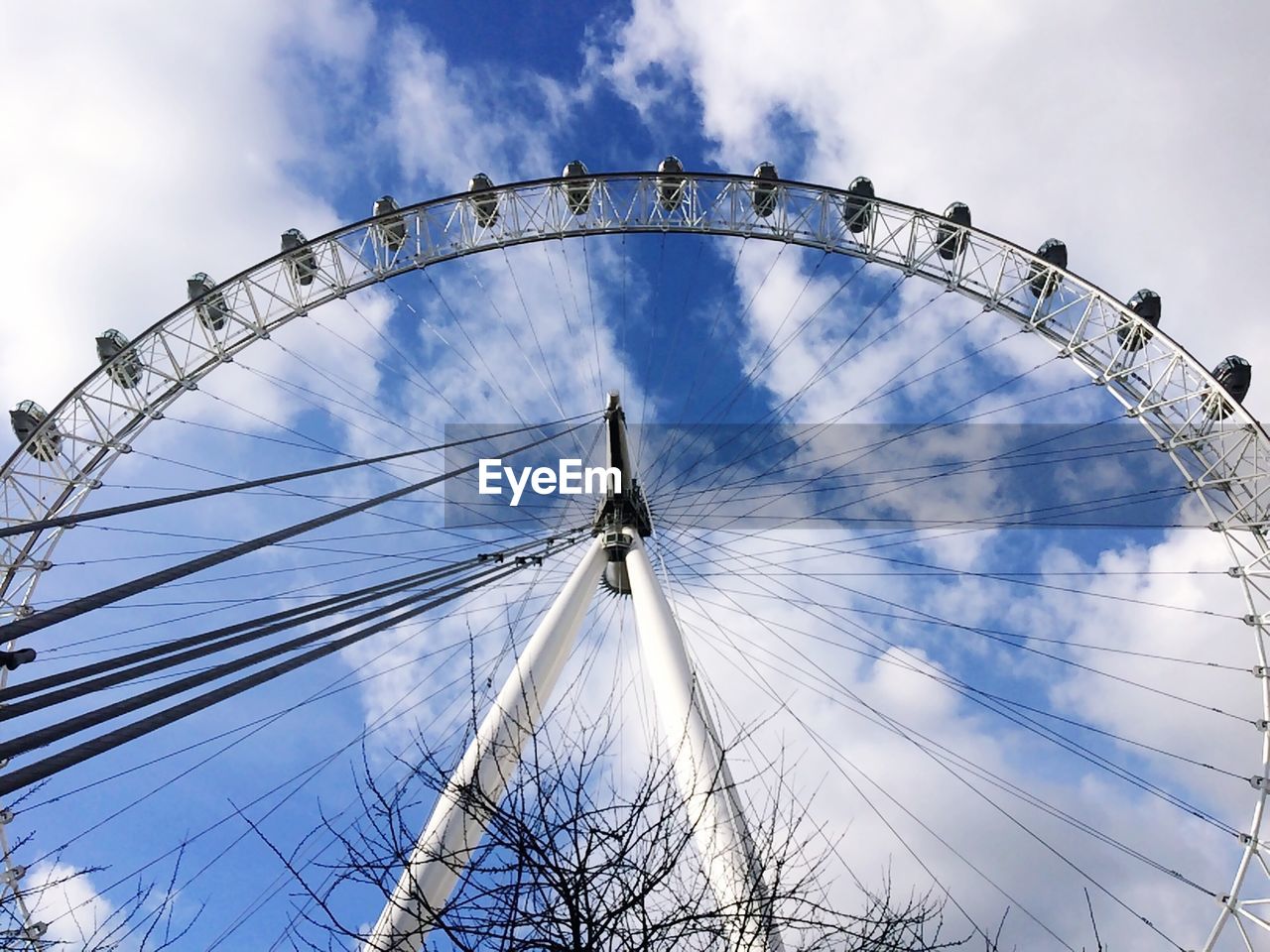 LOW ANGLE VIEW OF ROLLERCOASTER AGAINST SKY