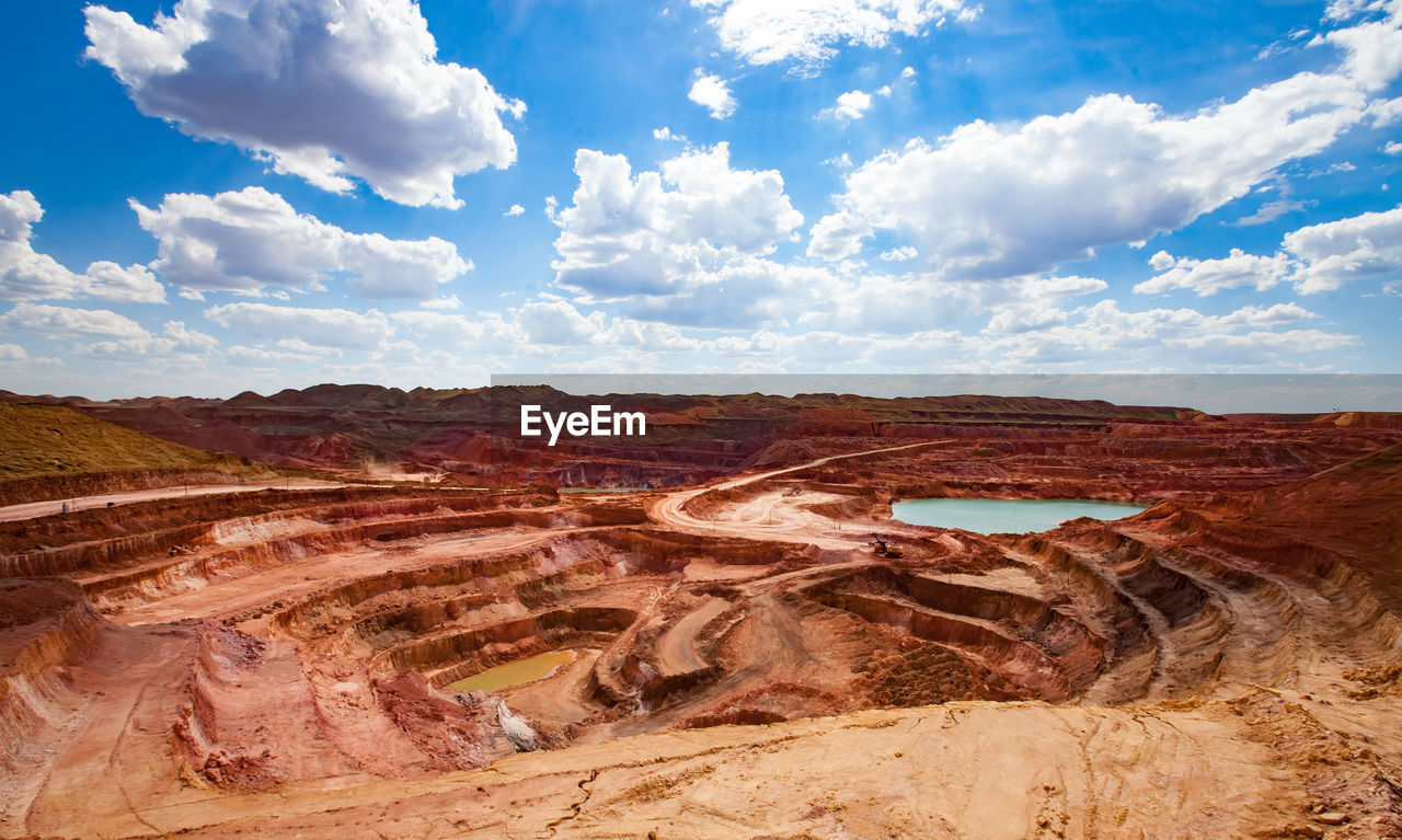 Scenic view of bauxite quarry landscape against sky